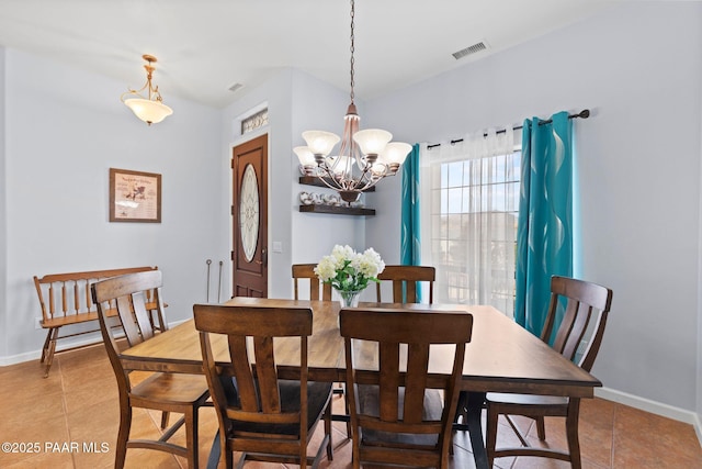 dining space with light tile patterned floors, a notable chandelier, baseboards, and visible vents