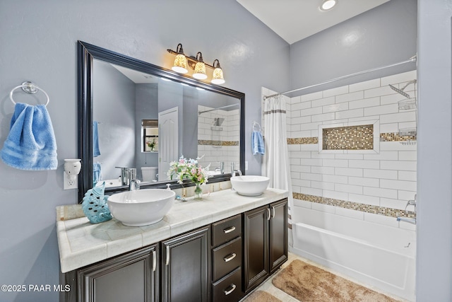 full bath featuring double vanity, shower / bathtub combination with curtain, and a sink