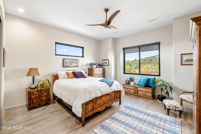 bedroom featuring ceiling fan and light hardwood / wood-style flooring