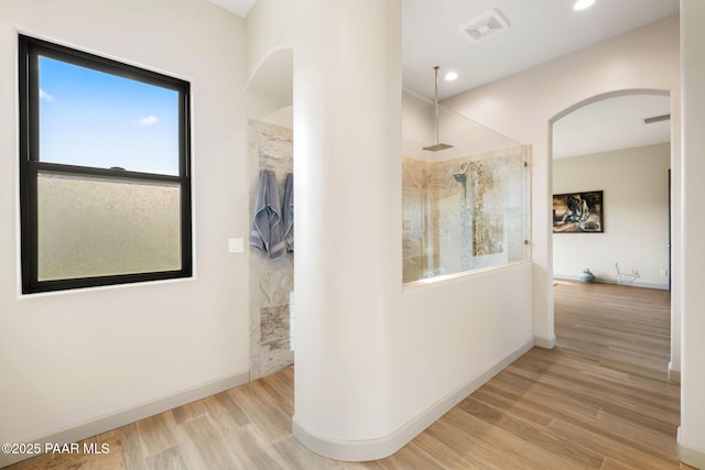 corridor featuring light hardwood / wood-style floors