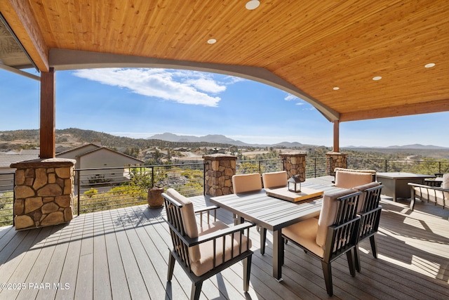 wooden deck featuring a mountain view