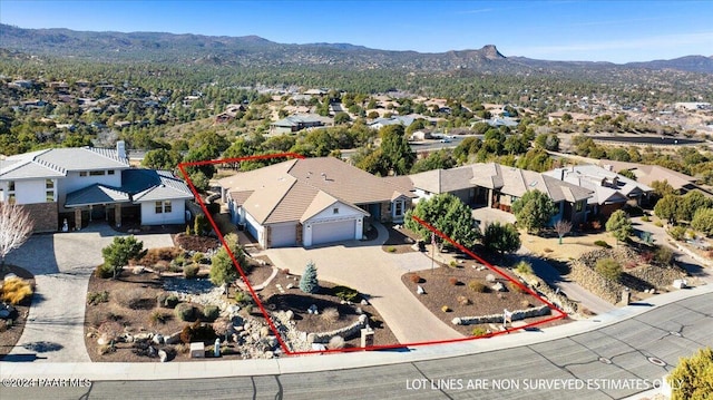 birds eye view of property with a mountain view