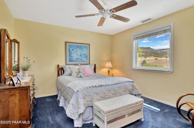 bedroom featuring baseboards, visible vents, and dark colored carpet