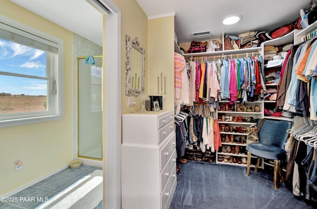 walk in closet with tile patterned floors and visible vents