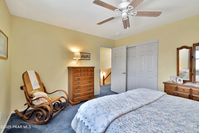 bedroom featuring a ceiling fan, carpet, a closet, and baseboards