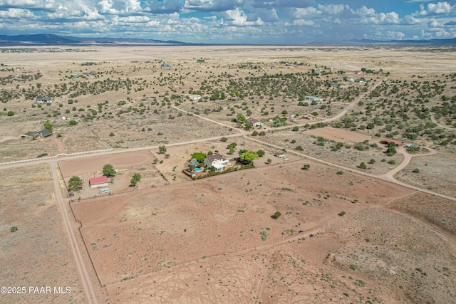 bird's eye view with a mountain view, a rural view, and view of desert