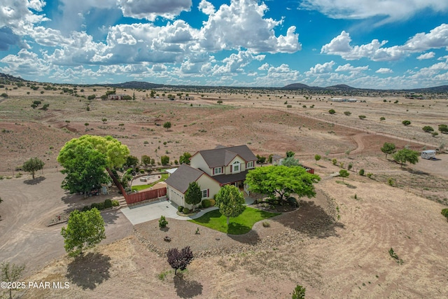 drone / aerial view featuring a mountain view and a rural view