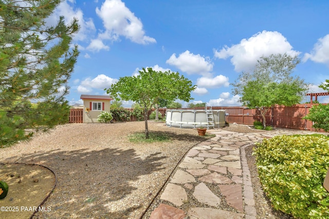 view of yard with a fenced backyard and a fenced in pool