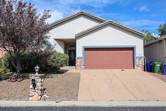 single story home featuring a garage