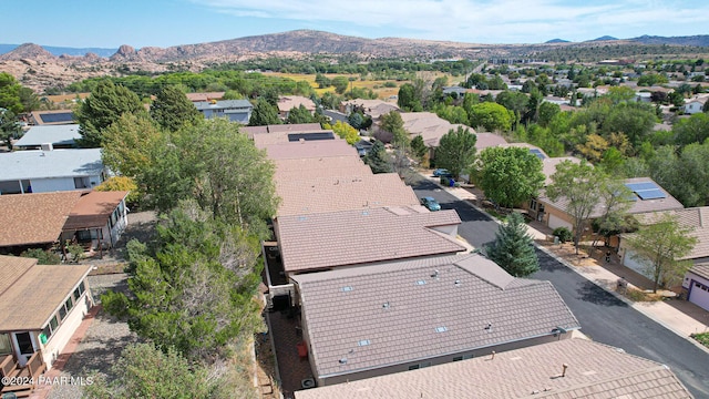 birds eye view of property with a mountain view