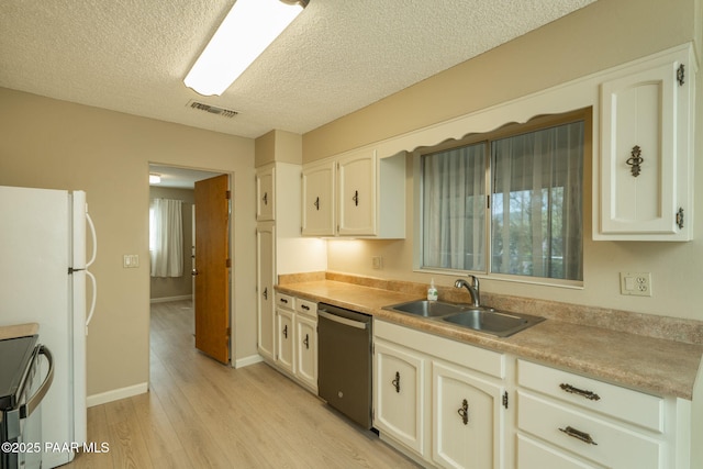 kitchen featuring range with electric cooktop, light wood finished floors, dishwasher, visible vents, and a sink