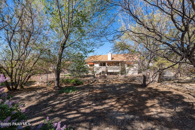 rear view of property with a chimney