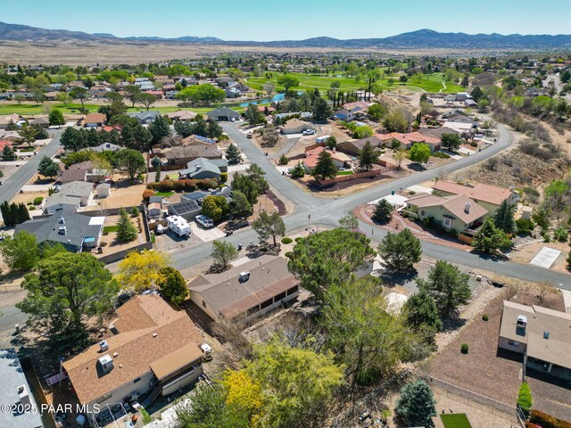 bird's eye view with a residential view, a desert view, and a mountain view
