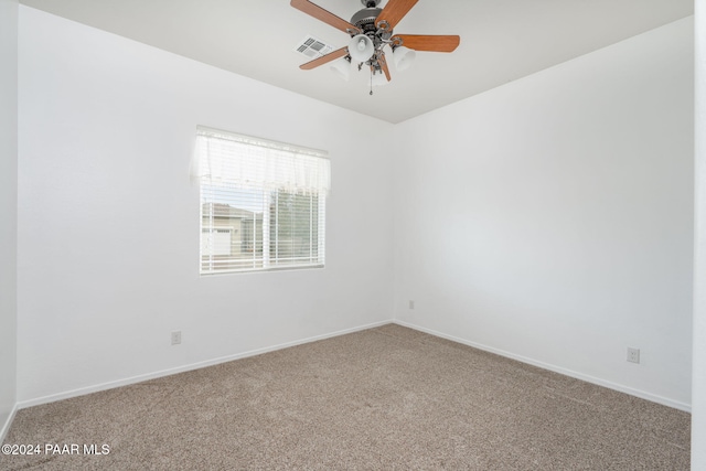 empty room featuring carpet flooring and ceiling fan