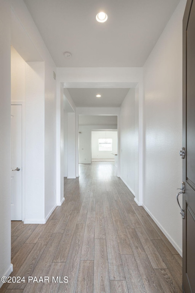 hall with light hardwood / wood-style floors