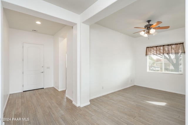 unfurnished room with ceiling fan and light hardwood / wood-style flooring