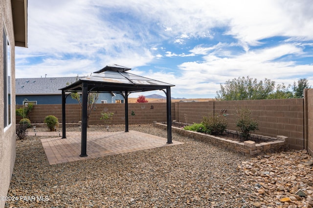 view of yard featuring a gazebo and a patio area