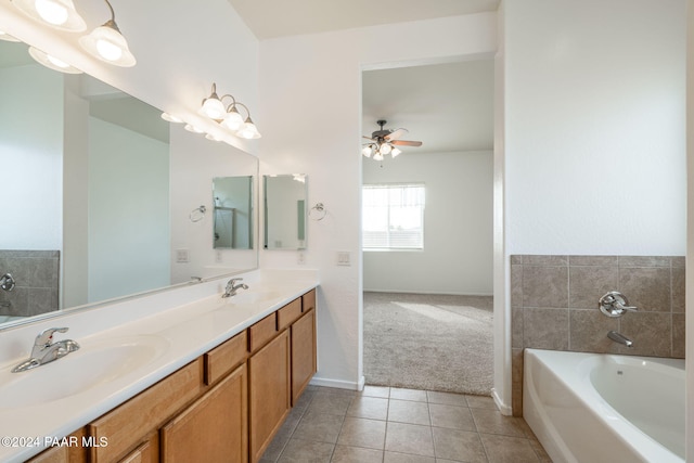 bathroom with tile patterned floors, vanity, ceiling fan, and a bath