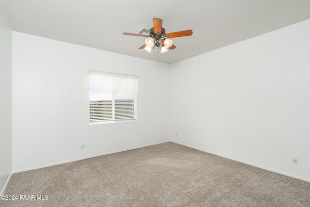 empty room with carpet flooring and ceiling fan