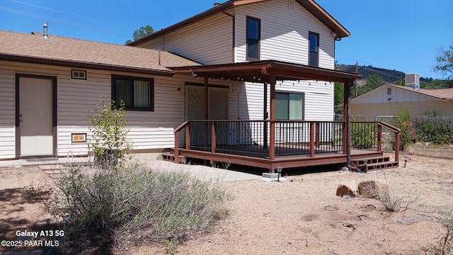 3035 Hozoni Rd, Prescott, AZ 86305 - back of property with a wooden deck and roof with shingles