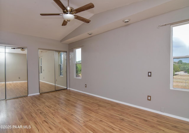 3035 Hozoni Rd, Prescott, AZ 86305 - unfurnished bedroom featuring lofted ceiling, light wood-type flooring, and two closets
