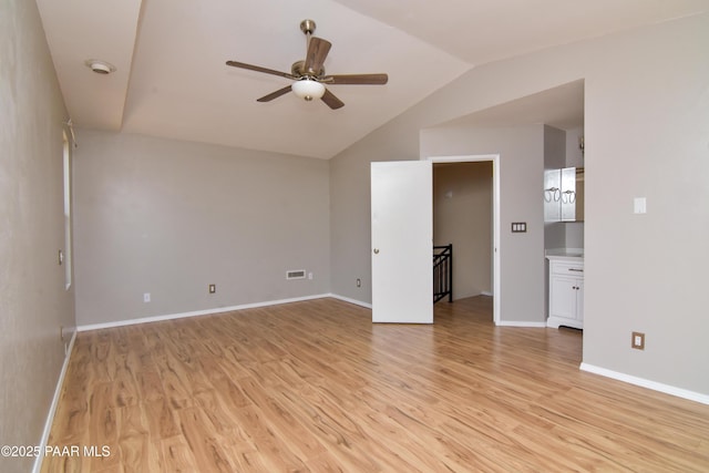 3035 Hozoni Rd, Prescott, AZ 86305 - empty room featuring ceiling fan, light wood-type flooring, vaulted ceiling, and a smoke detector