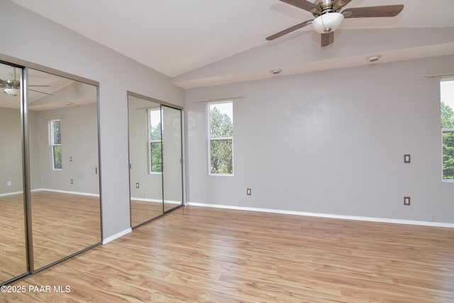 3035 Hozoni Rd, Prescott, AZ 86305 - unfurnished bedroom featuring two closets, light wood-style flooring, lofted ceiling, and a ceiling fan