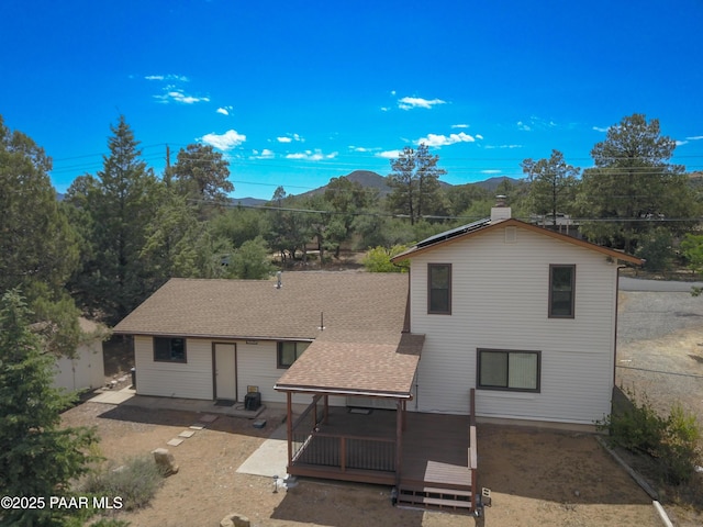 3035 Hozoni Rd, Prescott, AZ 86305 - rear view of property with a mountain view and a shingled roof