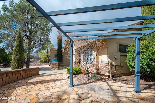 view of patio featuring a pergola