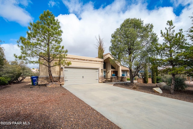 view of front facade featuring stucco siding, stone siding, concrete driveway, and an attached garage