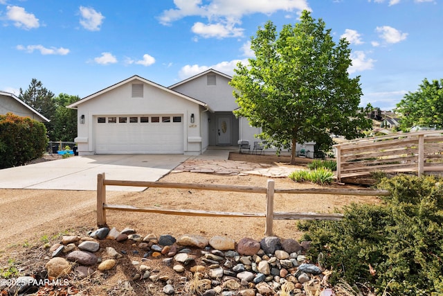 4714 N Sheridan Ln, Prescott Valley, AZ 86314 - single story home with a fenced front yard, a garage, concrete driveway, and stucco siding