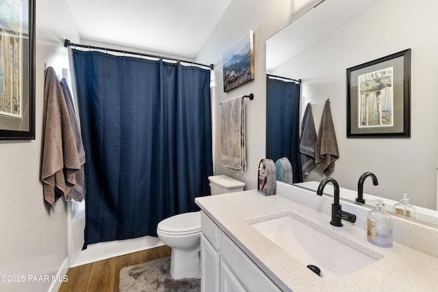 4714 N Sheridan Ln, Prescott Valley, AZ 86314 - bathroom with vanity, wood finished floors, toilet, and shower / bathtub combination with curtain