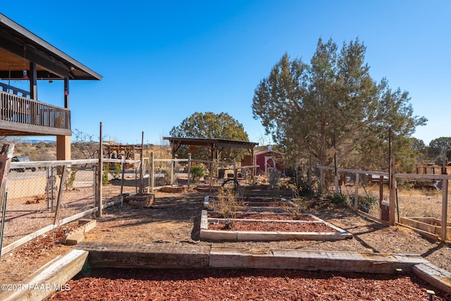 view of yard featuring a garden and fence