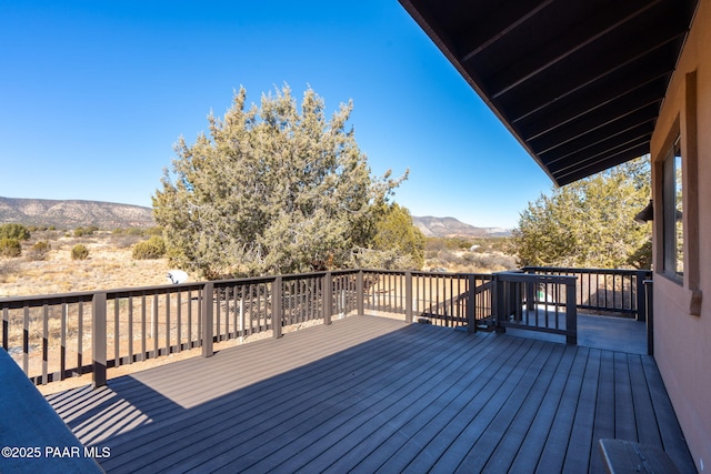 wooden terrace with a mountain view