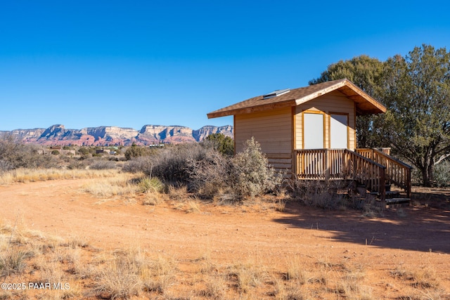 view of property exterior featuring a mountain view