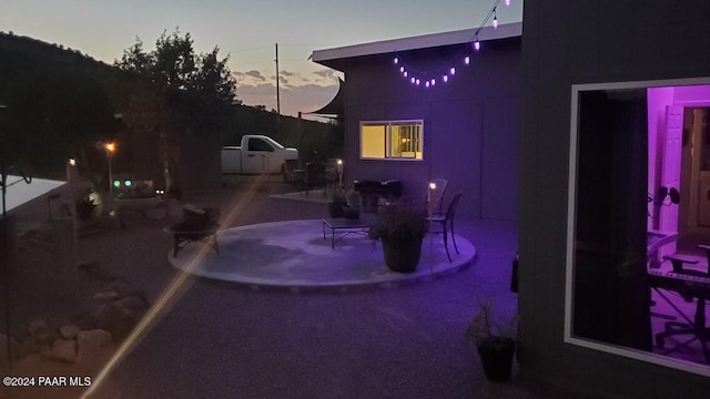 view of patio terrace at dusk