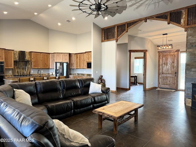 living room featuring ceiling fan and high vaulted ceiling