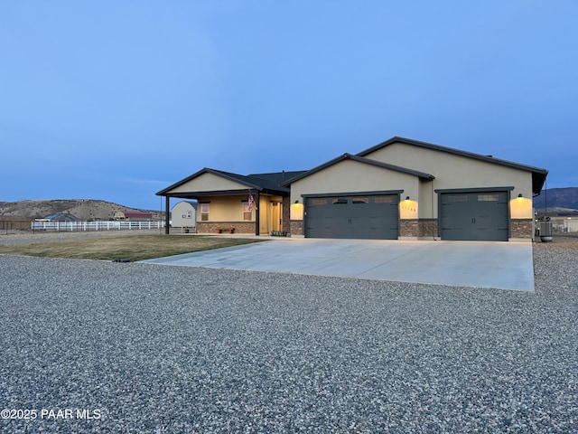 ranch-style house featuring a garage