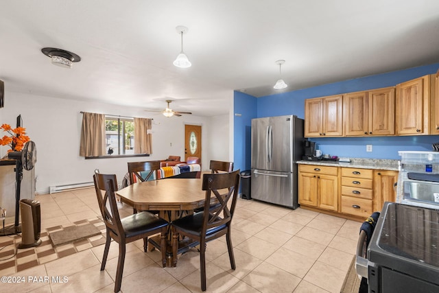 kitchen featuring light tile patterned floors, stainless steel fridge, pendant lighting, electric stove, and a baseboard heating unit