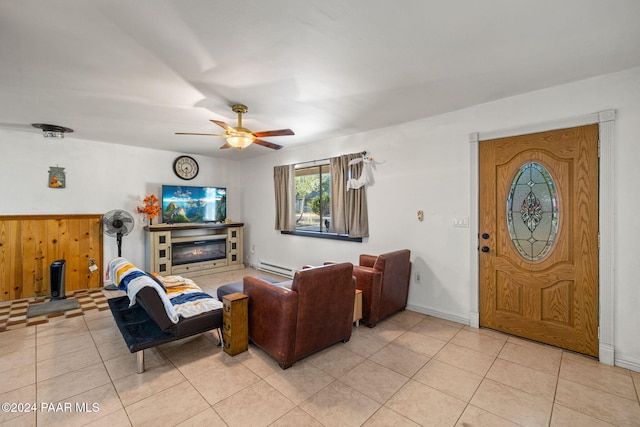 tiled living room featuring ceiling fan and a baseboard radiator