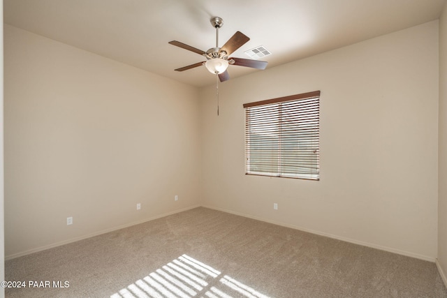 unfurnished room featuring ceiling fan and carpet floors