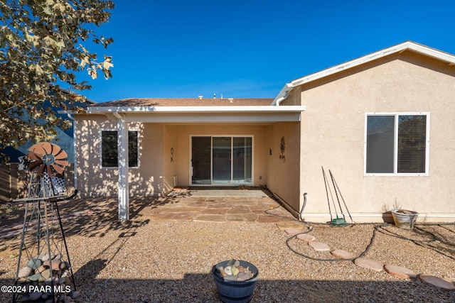 back of house with a patio area