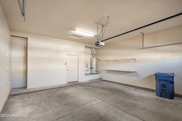 garage featuring a garage door opener and water heater