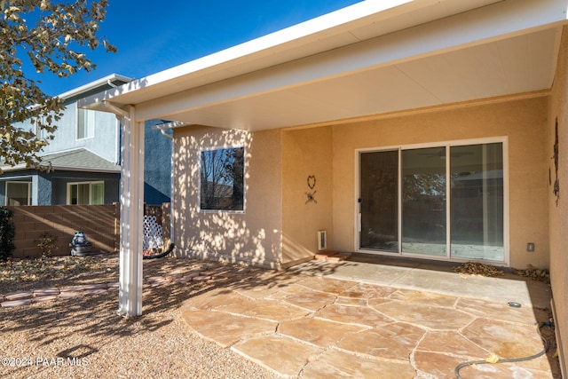 doorway to property with a patio