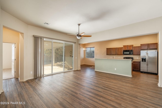 interior space with ceiling fan and dark hardwood / wood-style floors