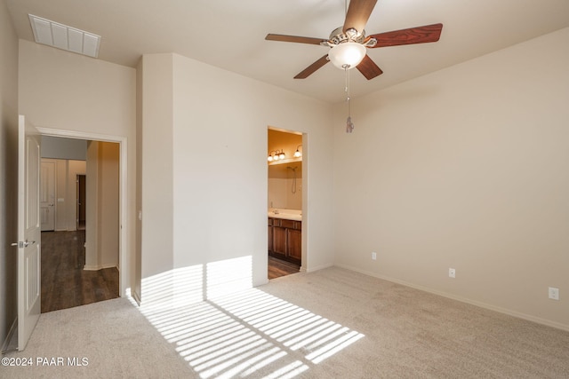 carpeted empty room with ceiling fan