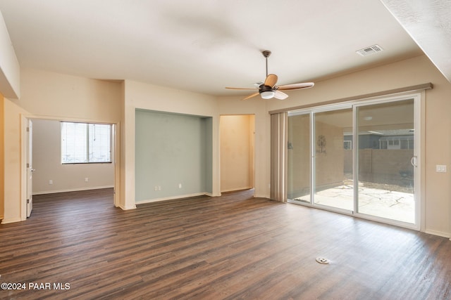 unfurnished room featuring dark hardwood / wood-style floors and ceiling fan