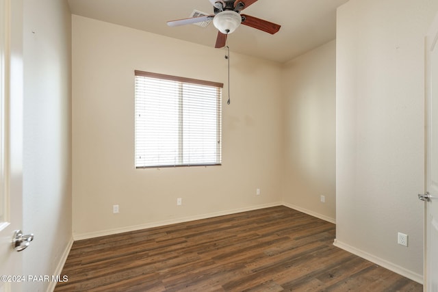 empty room featuring ceiling fan and dark hardwood / wood-style flooring