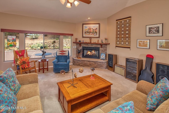 carpeted living room with ceiling fan, a fireplace, and vaulted ceiling