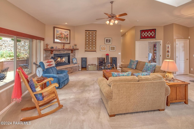 living room with a fireplace, light carpet, ceiling fan, and lofted ceiling